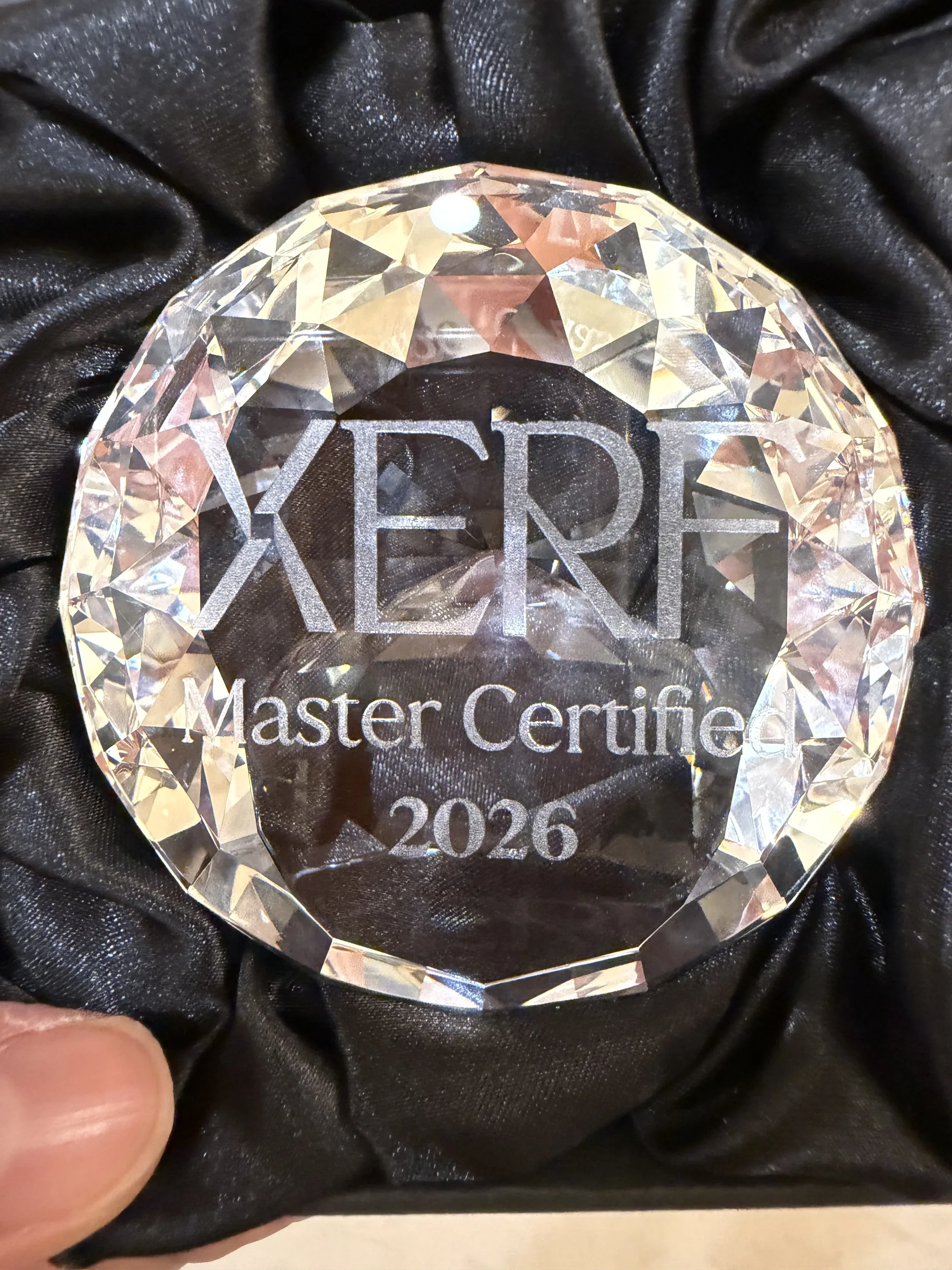 A crystal award engraved XERF Master Certified 2026